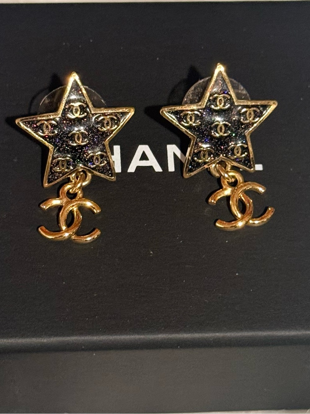 CHANEL Gold Star Drop Earrings with Black Enamel